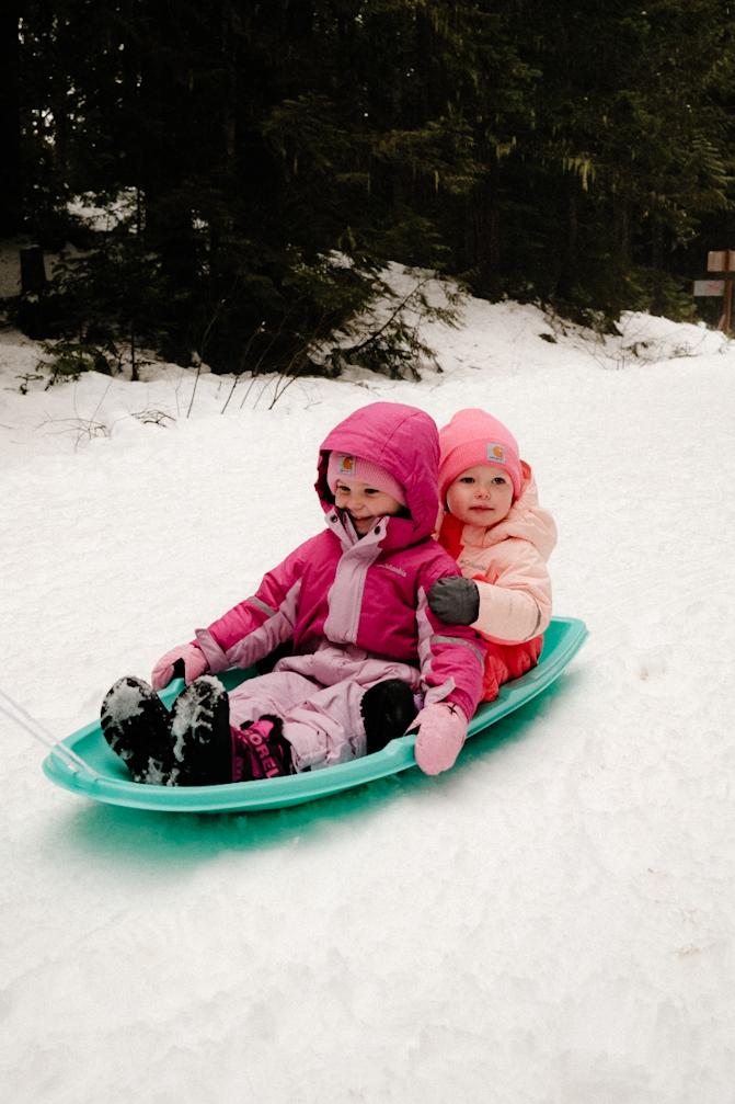 Brynn & Raylee sledding