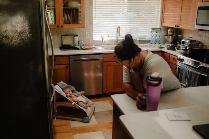 Sawyer hanging with mom in the kitchen