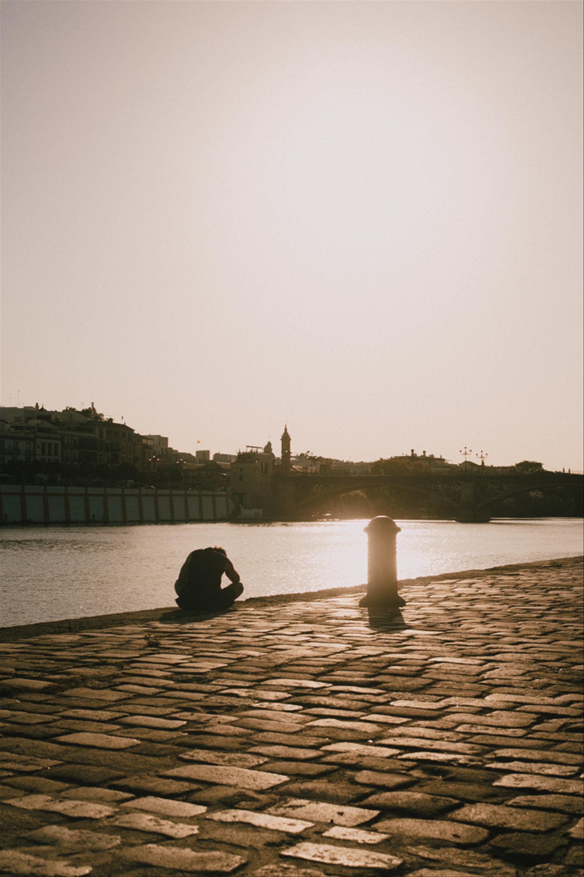 Man sitting by the river.