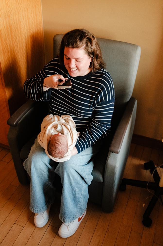 Aunt Emily taking a photo of Sawyer